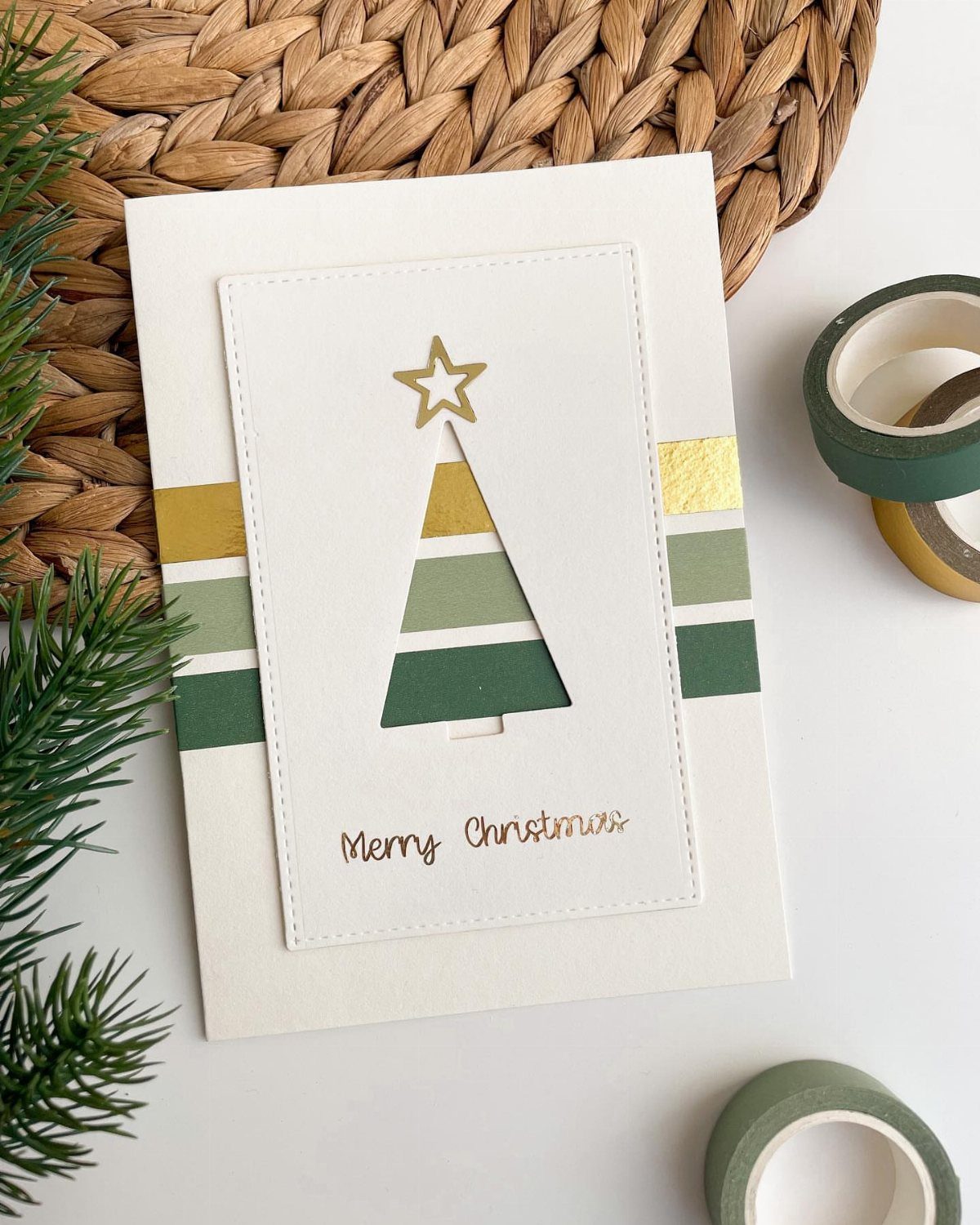 Christmas card with a washi tape tree cutout and gold star topper.