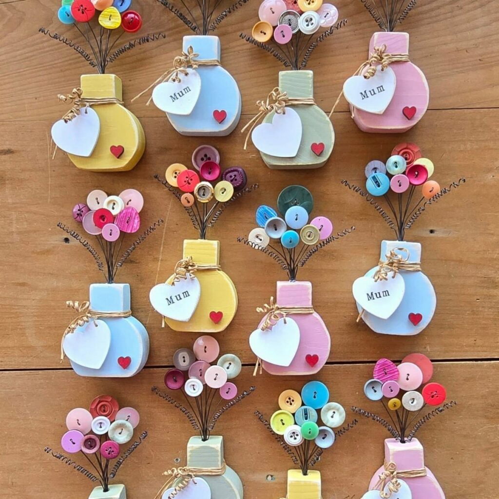 Colorful wooden vases with button bouquets and heart tags saying Mum on wood.